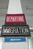 Departure and Immigration signs